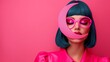 © Nataliia_Trushchenko - A woman with blue hair and pink glasses is wearing a pink shirt and a pink moon shaped headpiece
