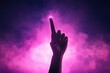 © weerasak - A silhouetted hand reaching upward into a mystical purple haze, symbolizing aspiration and enlightenment amidst vibrant colors.