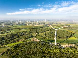 view of wind power turbine in field