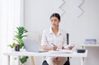 © David - Asian Business woman using calculator and laptop for doing math finance on an office desk, tax, report, accounting, statistics, and analytical research concept