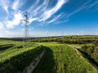 view of wind power turbine in field