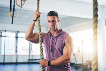 Canvas Print - Rope, fitness and man in gym, portrait and exercise with training, wellness and endurance. Face, athlete and healthy guy in facility, cardio workout and energy with mindset, confidence and challenge