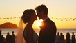 © Nuchylee - Romantic sunset wedding moment featuring a couple kissing against a stunning beach backdrop, capturing love and joy.