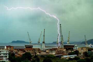 Perfect thunder drawing silhouette in the sky of Palermo, Sicily