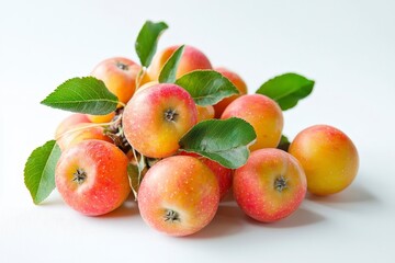 Wall Mural - A pile of fresh apples with green leaves on a white background.