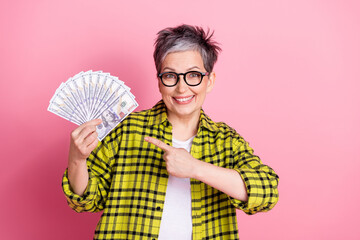 Poster - Photo of nice aged woman point finger cash checkered shirt isolated on pink color background