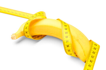 Wall Mural - Banana and yellow measuring tape on white background. Diet concept