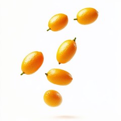 Wall Mural - Kumquats falling on white background.