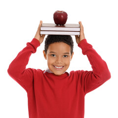 Wall Mural - Little African-American schoolboy with books and apple on white background