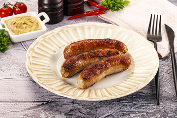 Delicous natural roasted sausages in the plate