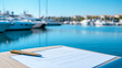 © fotogurmespb - Close-up of boat rental paperwork with a picturesque marina view in the background pens and documents ready for signing secure and easy boat rentals