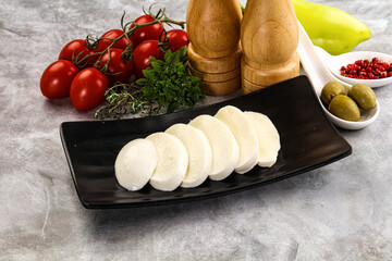 Wall Mural - Organic mozzarella cheese slices in the plate