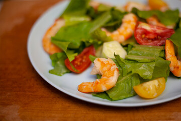 Salad with shrimp with cherry, lemon and vegetables. Healthy food. Homemade simple recipe