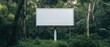 © JK_kyoto - An empty billboard stands amidst lush greenery, showcasing a blank canvas for creativity in nature.