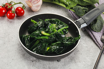 Wall Mural - Coocked green spinach with oil