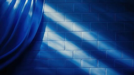 Wall Mural -   A brick wall with a blue curtain and a light shining through the top, illuminating the curtain