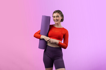 Wall Mural - Full body length gaiety shot athletic and sporty young woman with fitness matt in exercise posture on isolated background. Healthy active and body care lifestyle.