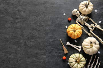 Wall Mural - Composition with ripe pumpkins and decorations for Halloween on dark background