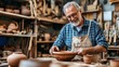 © A Denny Syahputra - A retiree works with clay, shaping a bowl while surrounded by pottery and wooden tools, enjoying his latest creative endeavor