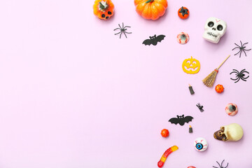 Poster - Composition with different decorations and candies for Halloween on lilac background