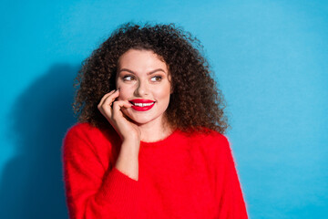 Wall Mural - Photo portrait of lovely young lady look empty space interested dressed stylish red garment isolated on blue color background