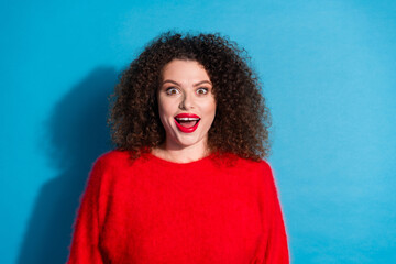 Wall Mural - Photo portrait of lovely young lady look camera excited dressed stylish red garment isolated on blue color background