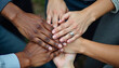 © sanart design - Diverse group of hands coming together, symbolizing unity, teamwork and community