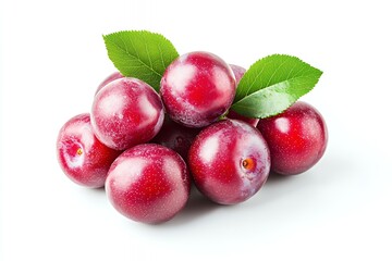 Wall Mural - A cluster of fresh, shiny red plums with green leaves on a white background.