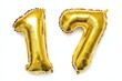 © Yeivaz - Number 17 golden inflatable foil balloons. Bright party decoration. Seventeen years on white background