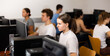 © JackF - Teenage girl sitting at table and using computer during lesson.