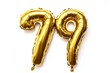 © Yeivaz - Number 79 golden inflatable foil balloons. Bright party decoration. Seventy nine years on white background