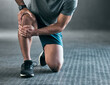 © Haas/peopleimages.com - Man, hands and knee pain with injury in muscle tension, accident or fitness on floor at gym. Closeup of male person with sore leg, ache or inflammation in strain, pressure or sprain at health club