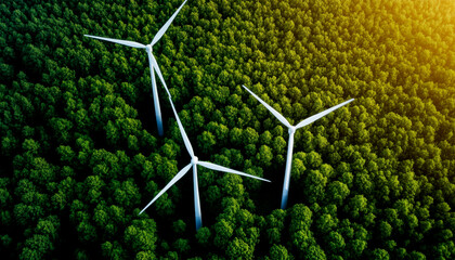 Aerial view of wind turbines surrounded by lush green trees, highlighting renewable energy and nature's harmony.