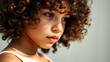 © Rysak - Close-up portrait of a young girl with curly brown hair