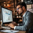 © sok - Businessman analyzing financial data on computer