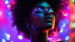 © arhendrix - A vibrant, colorful portrait of a woman with glitter makeup and an afro, set against a neon, bokeh background.