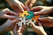 © SUPHANSA - A close-up of puzzle pieces being placed together by multiple hands, symbolizing the way each individual's contribution is essential to completing the bigger picture in t