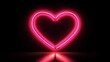 © WITTAYA  ANGMUJCHA - A neon heart is lit up in a dark room