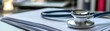 © ImagePulse - Close-up of stethoscope on organized medical documents, healthcare admin in background, detailed scene