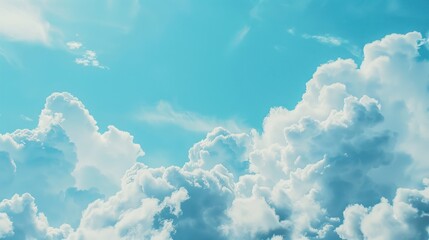 Wall Mural - Fluffy White Clouds Against a Vibrant Blue Sky