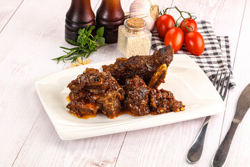 Prepared tasty beef ribs with sauce