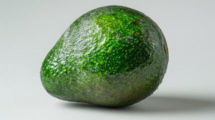 Wall Mural - A whole avocado isolated on a white background