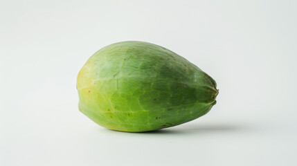 Wall Mural - A whole green papaya isolated on white