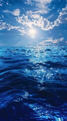 Wall Mural - A beautiful blue ocean with the sun shining brightly on the water