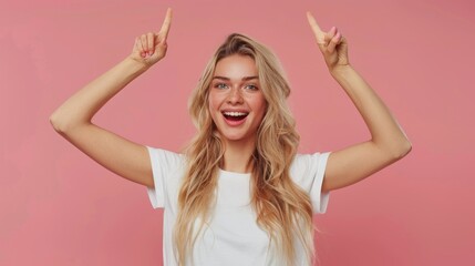 A woman with blonde hair is smiling and pointing her fingers up