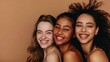 © liliyabatyrova - Three women with different hair types and skin tones are smiling