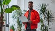 © Studio Nova - The man holding laptop.