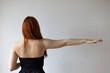 © Alessandro Grandini - Redhead woman stretching arm showing back muscles