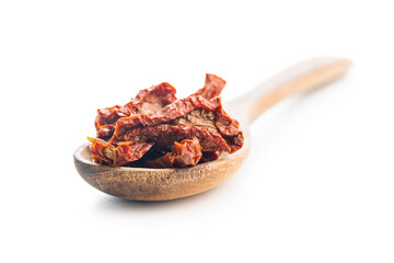 Wall Mural - Sun dried red tomatoes on wooden spoon isolated on white background.