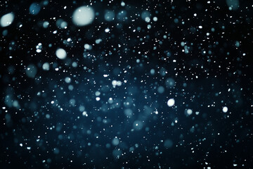 black and white photo of snowflakes falling from the sky. The snowflakes are scattered all over the image, creating a sense of movement and chaos. The photo evokes a feeling of winter